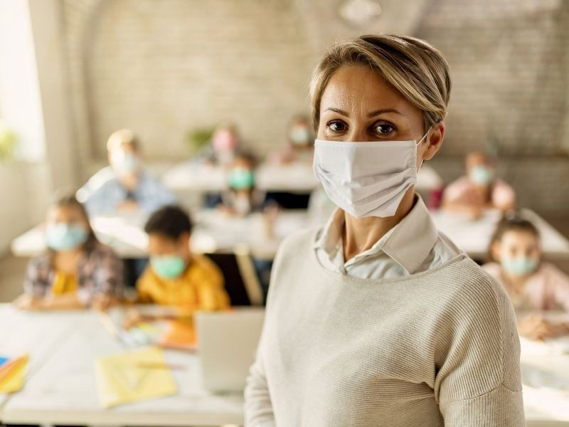 Teacher and students in classroom wearing face masks